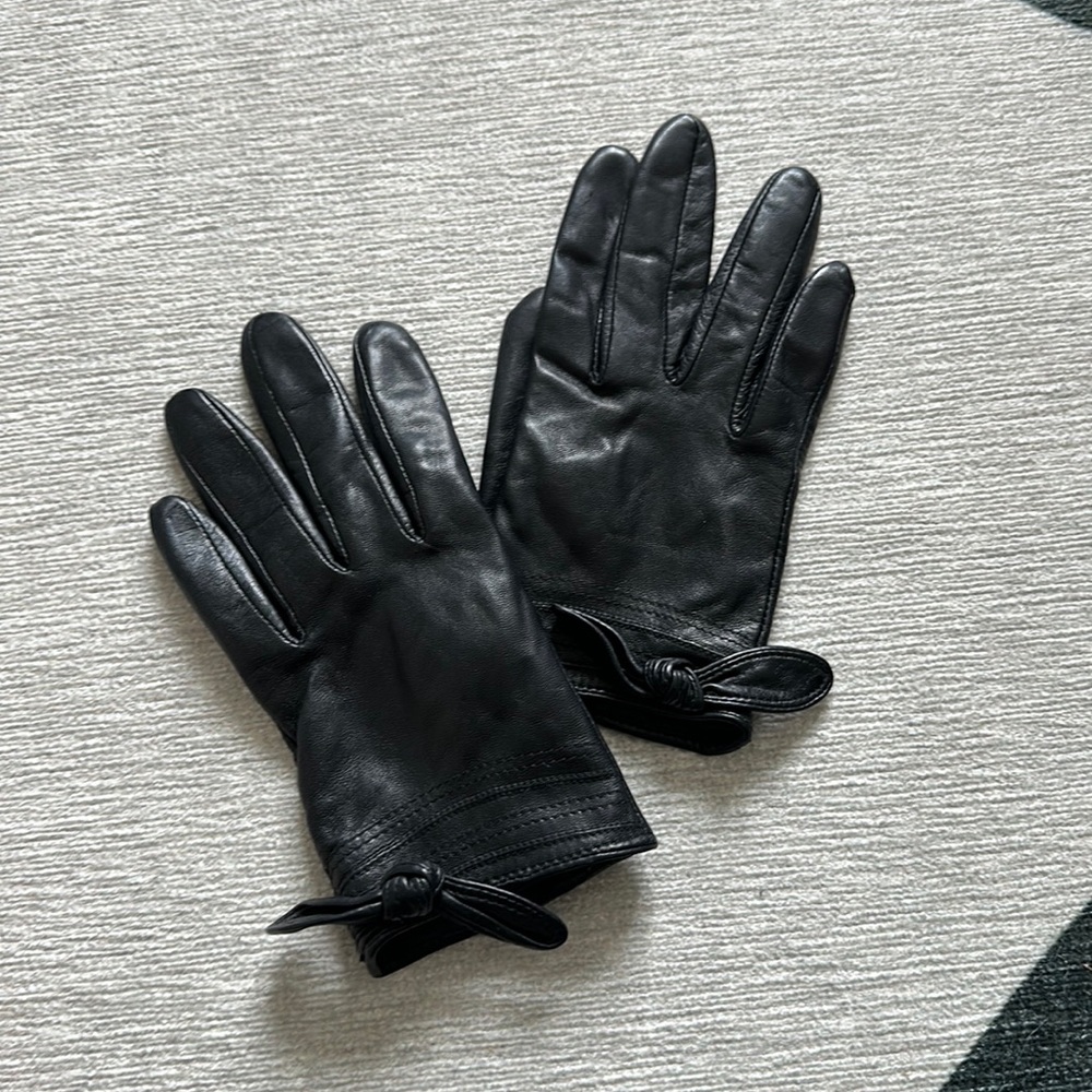 Black leather wrist length gloves
